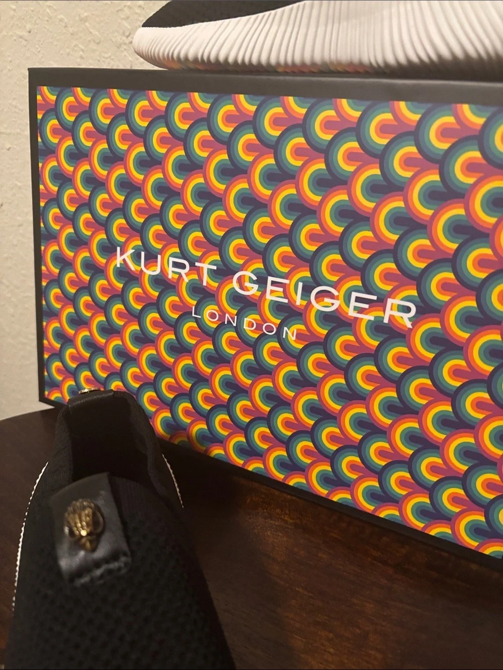 Kurt Geiger Black Knit Slip-On Sneakers with Gold Emblem
